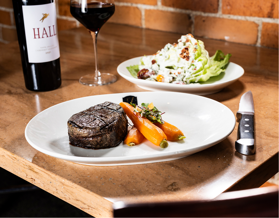 steak with chopped salad and wine